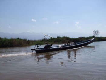 Boat in sea against sky