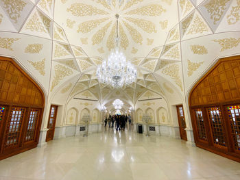 Low angle view of illuminated chandelier in building