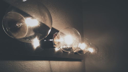 Light bulb in illuminated room