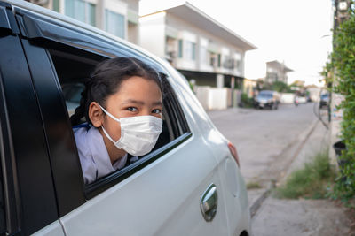 Portrait of girl in car