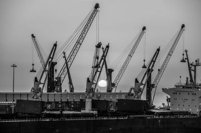 Cranes at construction site at night