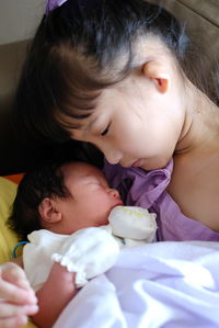 Close-up of boy eating food at home