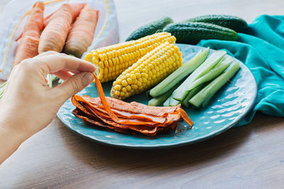 High angle view of person preparing food on table