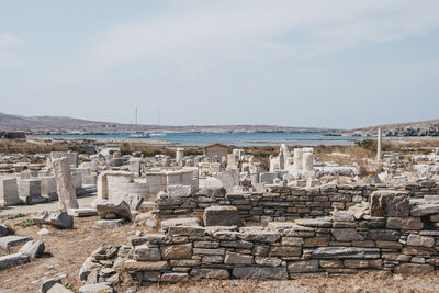 The remains of a buildings and agora of the competaliasts on the island of delis, greece.