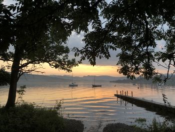 Scenic view of lake against sky during sunset