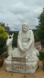 Statue of buddha against sky