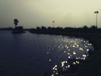 Scenic view of river against sky at sunset