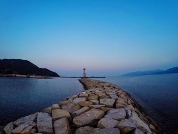 Scenic view of sea against blue sky