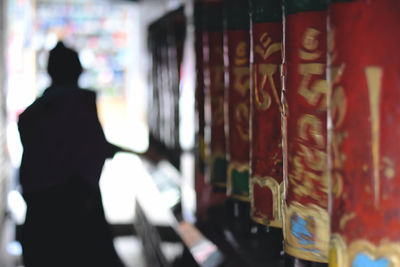 Rear view of man looking at camera
