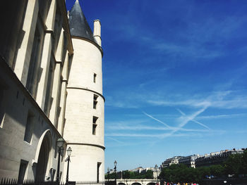 Low angle view of buildings against blue sky