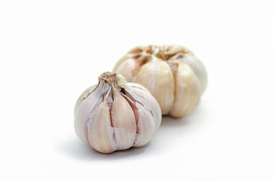 Close-up of pumpkins against white background