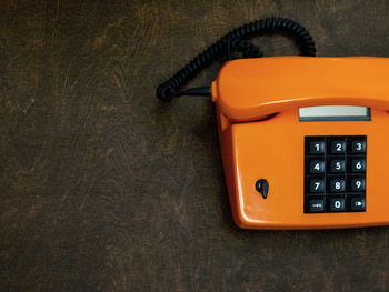 Close-up of telephone on table