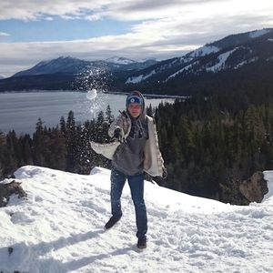 Woman standing on snow covered lake