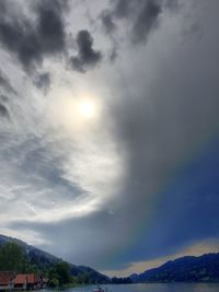 Scenic view of mountains against cloudy sky