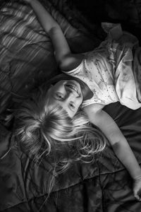 Portrait of cute girl lying on bed