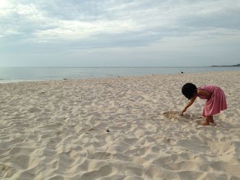 Girl bending while at beach