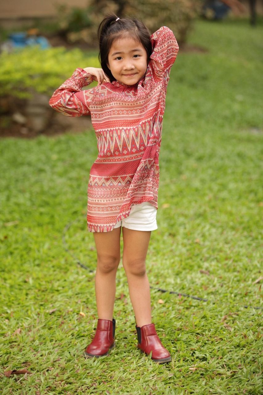 PORTRAIT OF A SMILING GIRL