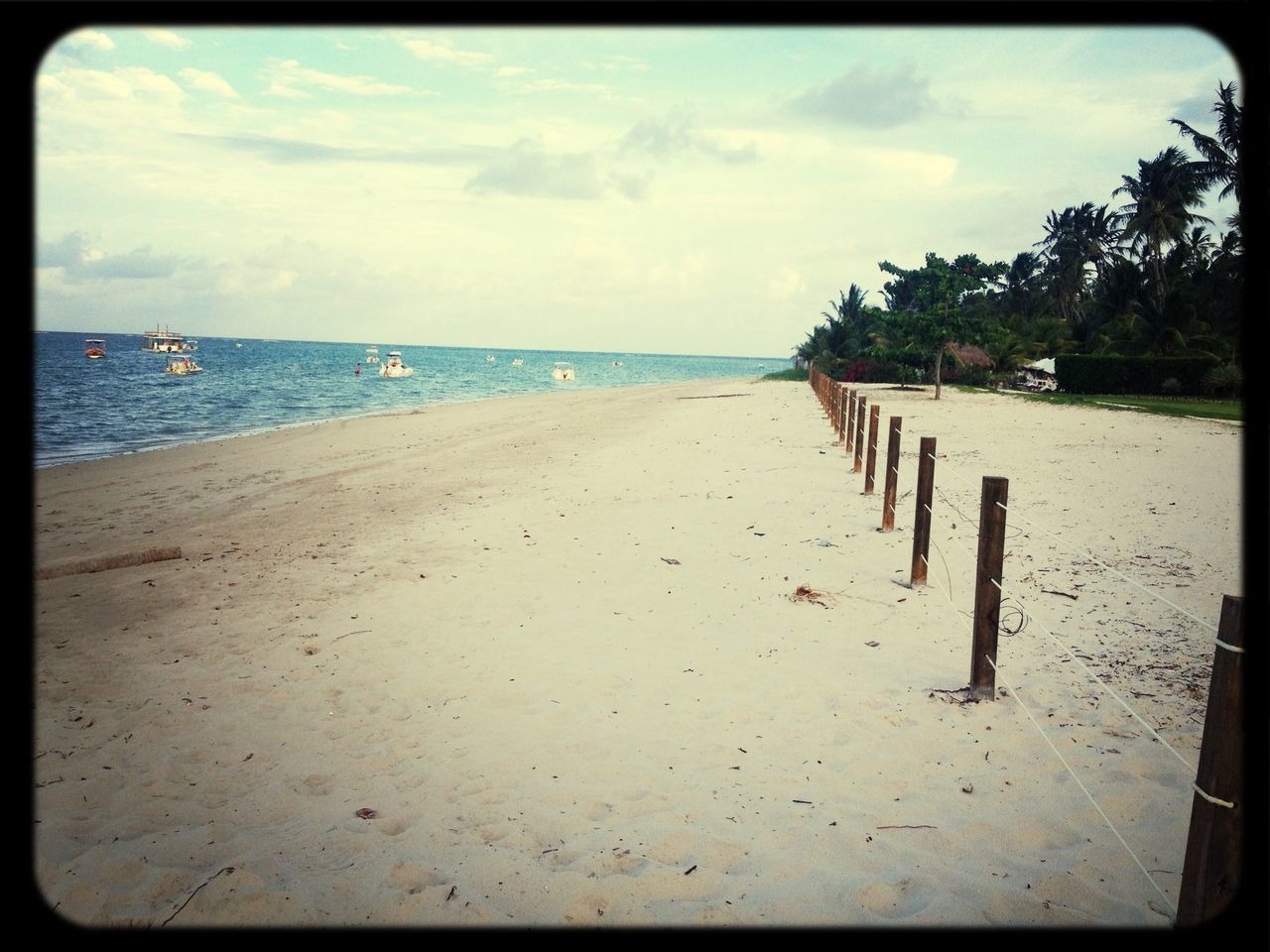 sea, beach, sky, water, horizon over water, sand, shore, cloud - sky, tranquil scene, tranquility, scenics, cloud, beauty in nature, cloudy, nature, incidental people, coastline, idyllic, day, auto post production filter