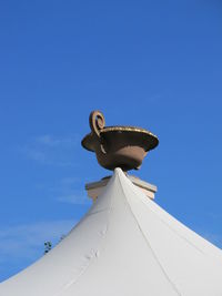 Low angle view of statue against clear blue sky