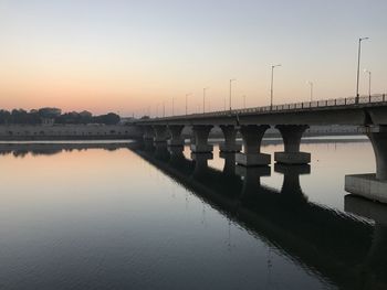 Scenic view of bridge against sky during sunset