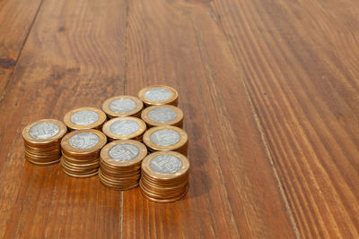 High angle view of coins on table