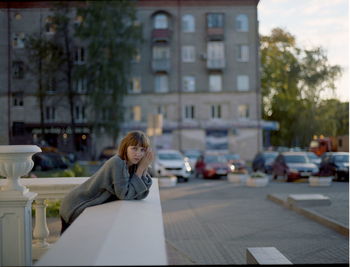 Woman using smart phone in city