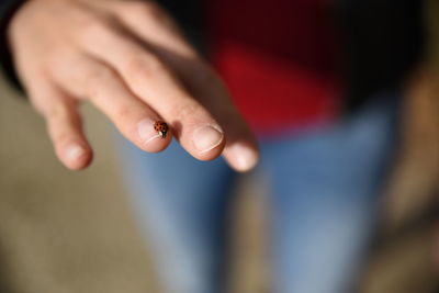 Close-up of woman hand on blurred background