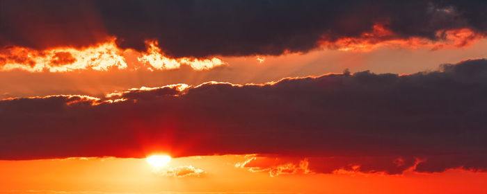 Low angle view of dramatic sky during sunset