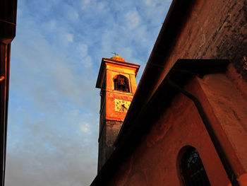Low angle view of bell tower against sky