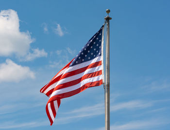 Low angle view of flag against sky