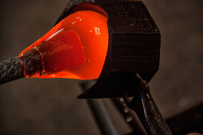 Close-up of glass being molded in factory