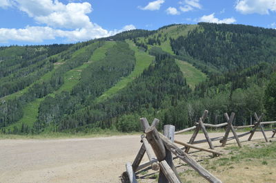 Idyllic shot of green mountain against sky