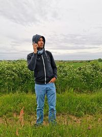 Full length of man standing on field