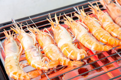 High angle view of meat on barbecue