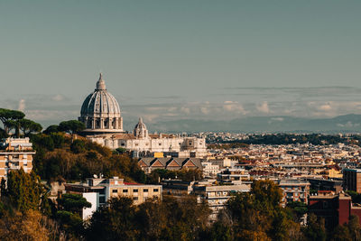 Vatican buildings in city against clear sky