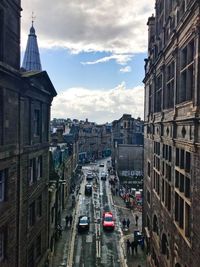 High angle view of traffic on road amidst buildings in city