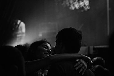 Rear view of two men at music concert