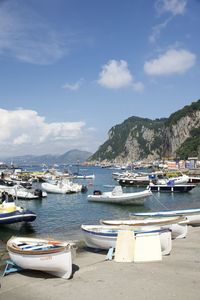 Boats moored at harbor