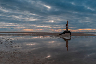 Yoga asanas on the background of dawn