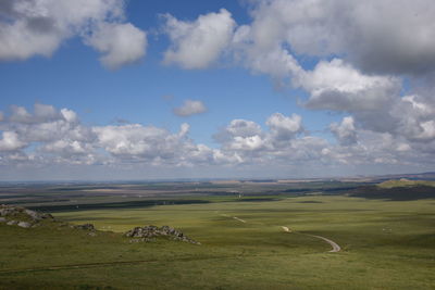 Scenic view of agricultural field against sky