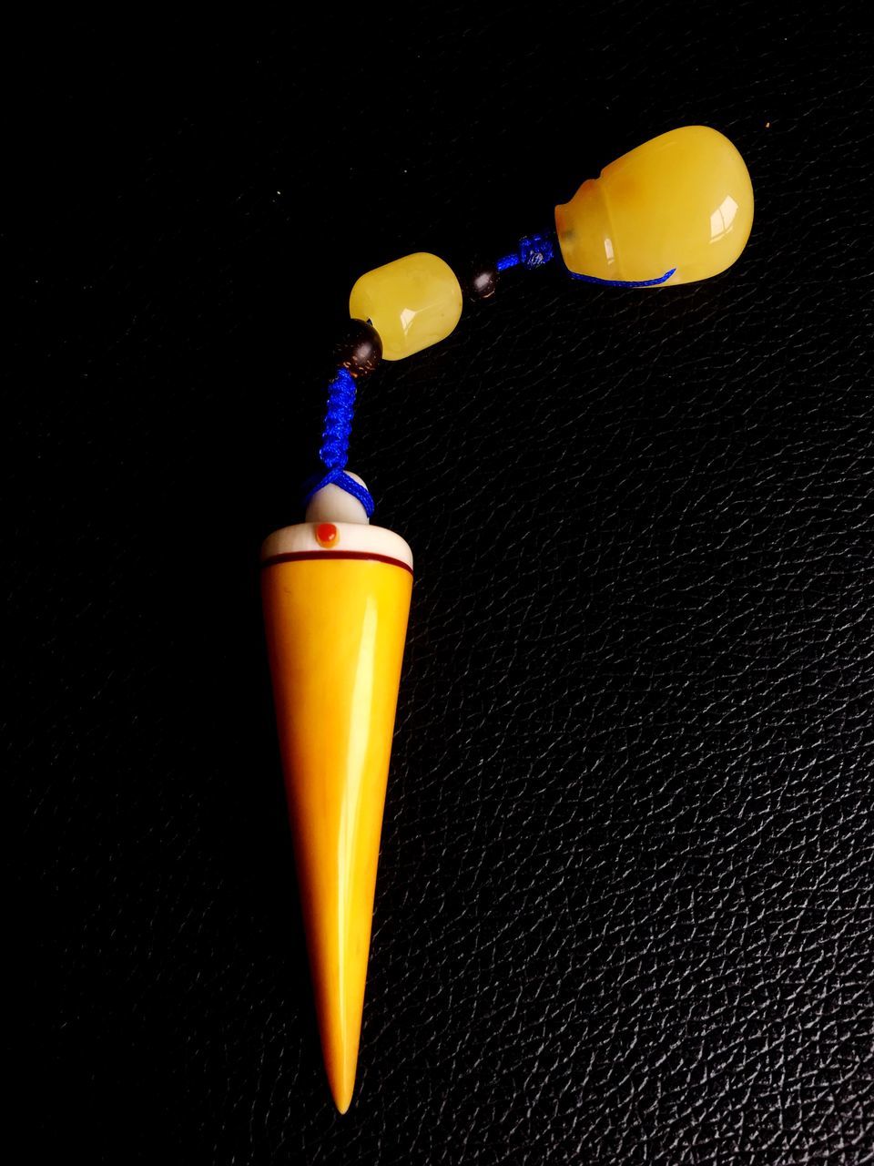 illuminated, yellow, studio shot, still life, lighting equipment, close-up, copy space, night, indoors, single object, electricity, glowing, black background, no people, light - natural phenomenon, light bulb, electric light, table, blue, orange color