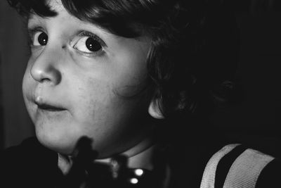 Close-up portrait of boy looking away