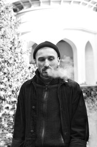 Portrait of young man standing outdoors