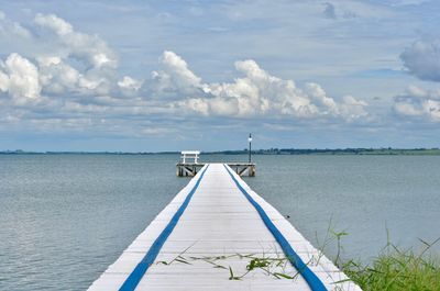 Pier over sea against sky