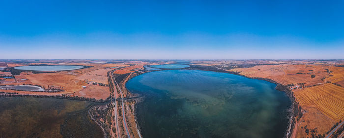 Scenic view of landscape against clear blue sky