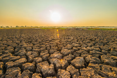 Scenic view of field against sky during sunset