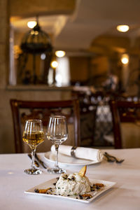 View of wine glasses on table in restaurant