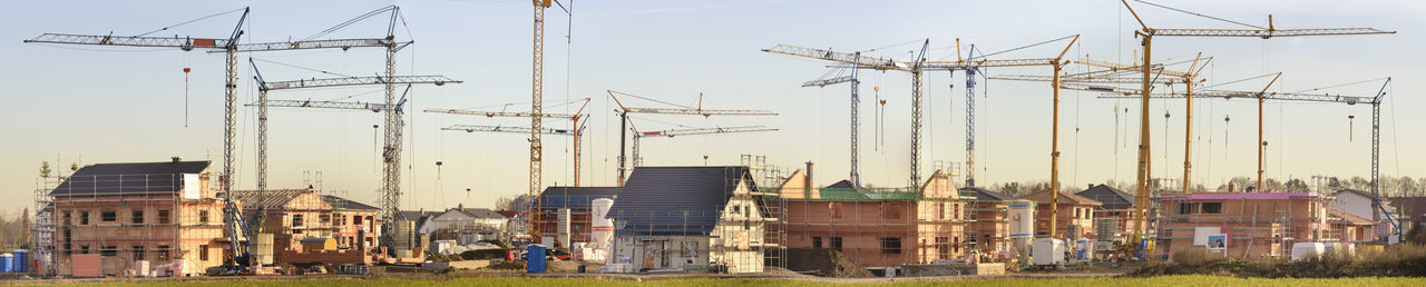 Buildings in city against clear sky