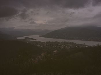 Scenic view of mountains against cloudy sky