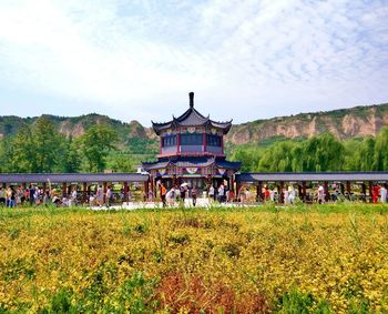 Large group of tourists visiting historical building